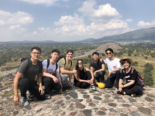 A group of students gathered at the top of Teotihuacan, outside of Mexico City