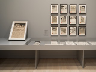 An image of framed documents and artifacts in a gallery
