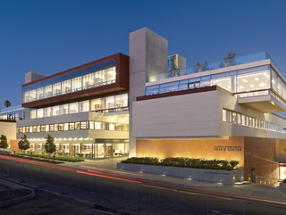 Exterior shot of the Kravis Center at Claremont Colleges, a five-level administrative building with outdoor spaces and a rooftop courtyard.