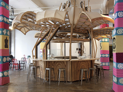 Image of a food kiosk and champagne bar in the Grand Central Market