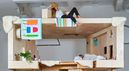 Image of people lounging on an indoor treehouse