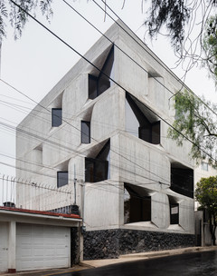 Image of an angular buidling made of concrete and glass