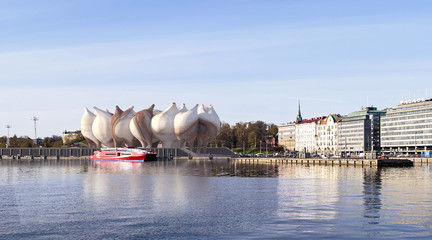 Rendering of a vessel-like building next to a river