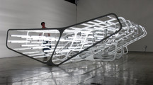 Image of an installation made of articifial light and steel in a gallery space