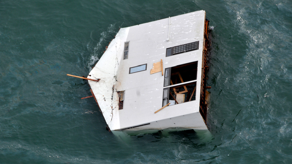 Image of a house under water after a natural disaster