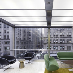 Image of a modernist interior of an office building looking out to a New York cityscape