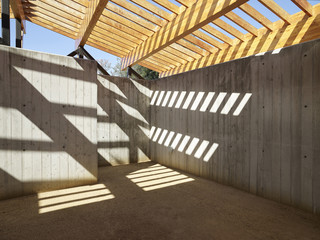 Image of concrete interior with wooden roof