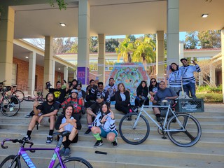Cyclists gather to activate "Grieving Sun Mural" in a memorial for deceased cyclists. Photo courtesy UCLA Luskin School of Public Affairs.