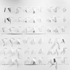 A black and white drawing showing 54 different shapes of folded materials