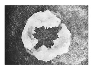 aerial view of a mountain shrouded in clouds