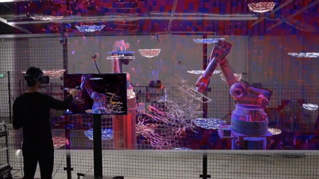 Video still of a student manipulating robotos through VR