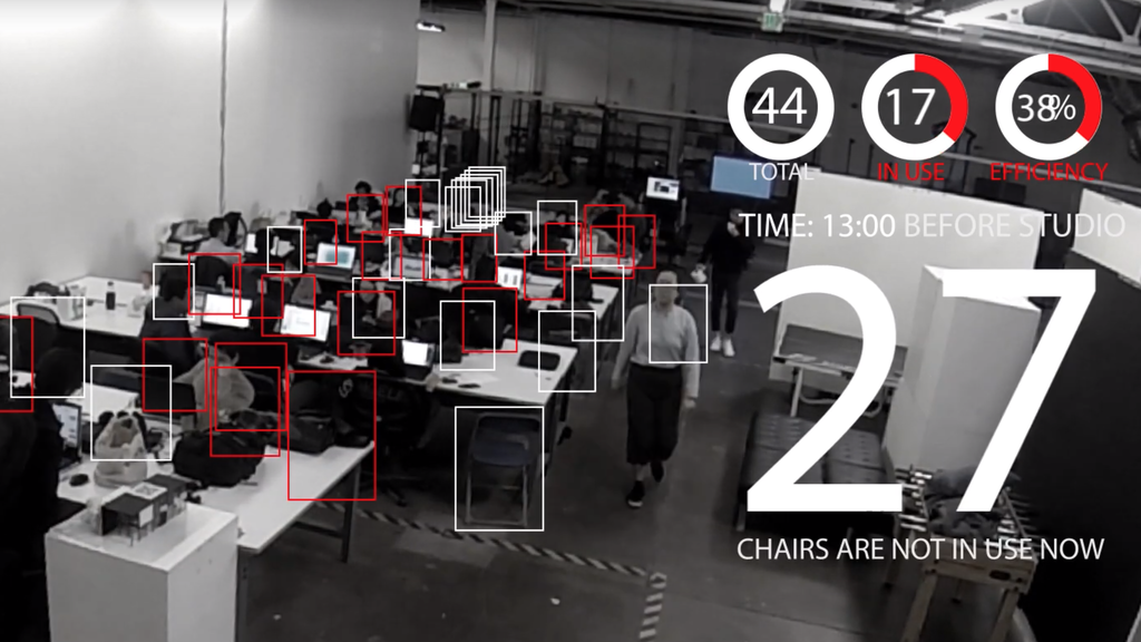 Screenshot from the video showing a robotic red chair navigating a constructed maze using mapping technology.