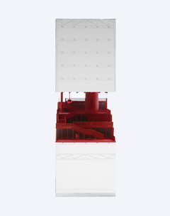 White model with red staircase cutting through the middle of the building.