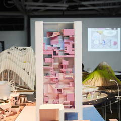 Image of a final student model representing a high-rise structure with a pink interior on the reimagined island of Tuvalu.